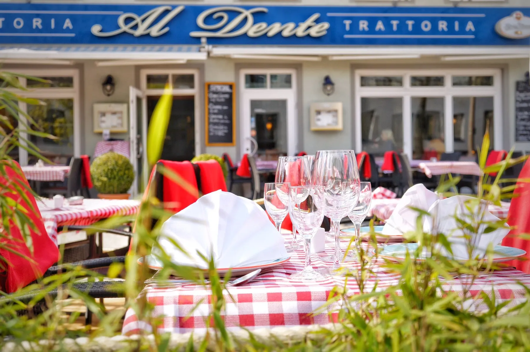 Laid tables on the terrace of AL Dente